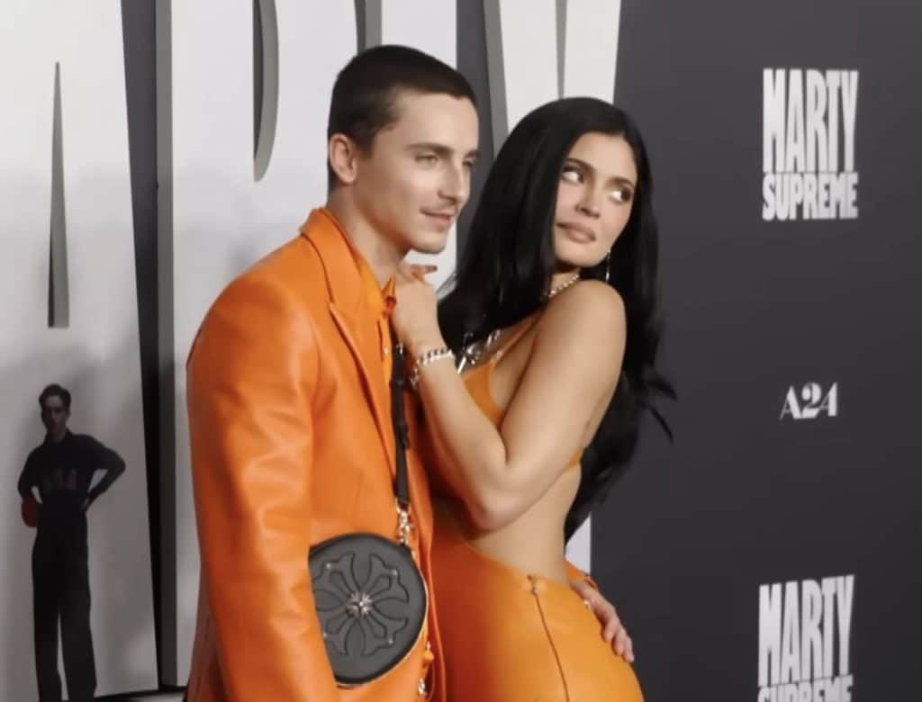 Timothee Chalamet and Kylie Jenner posing for pictures at the Marty Supreme premier.
