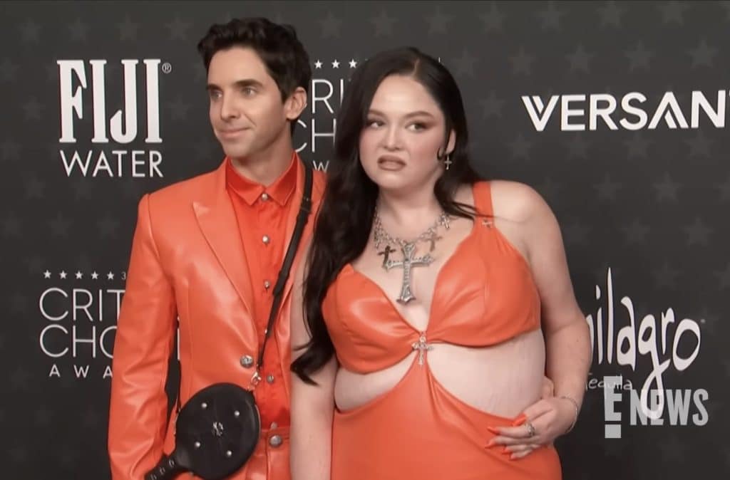 Meg Stalter and Paul W. Downs posing for pictures at the Critics Choice Awards.