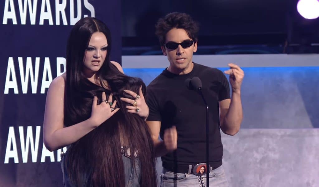 Meg and Paul W. Downs presenting an award at the American Music Awards.