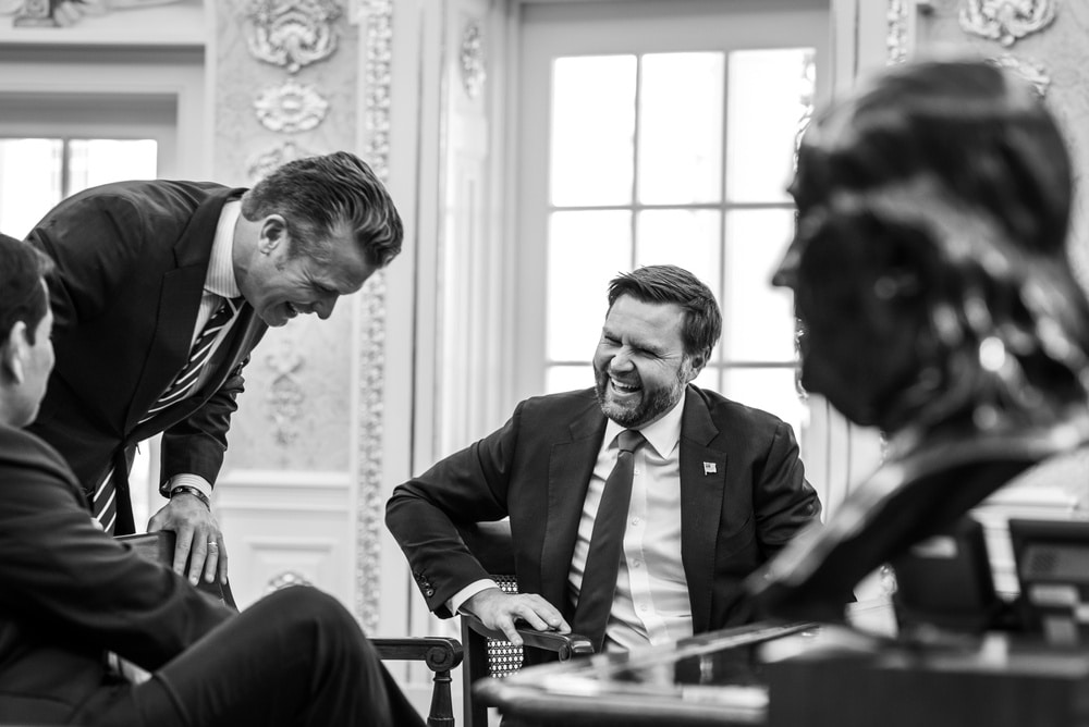 Vice President JD Vance, Secretary of War Pete Hegseth, and Secretary of State Marco Rubio laughing when meeting with President Donald Trump