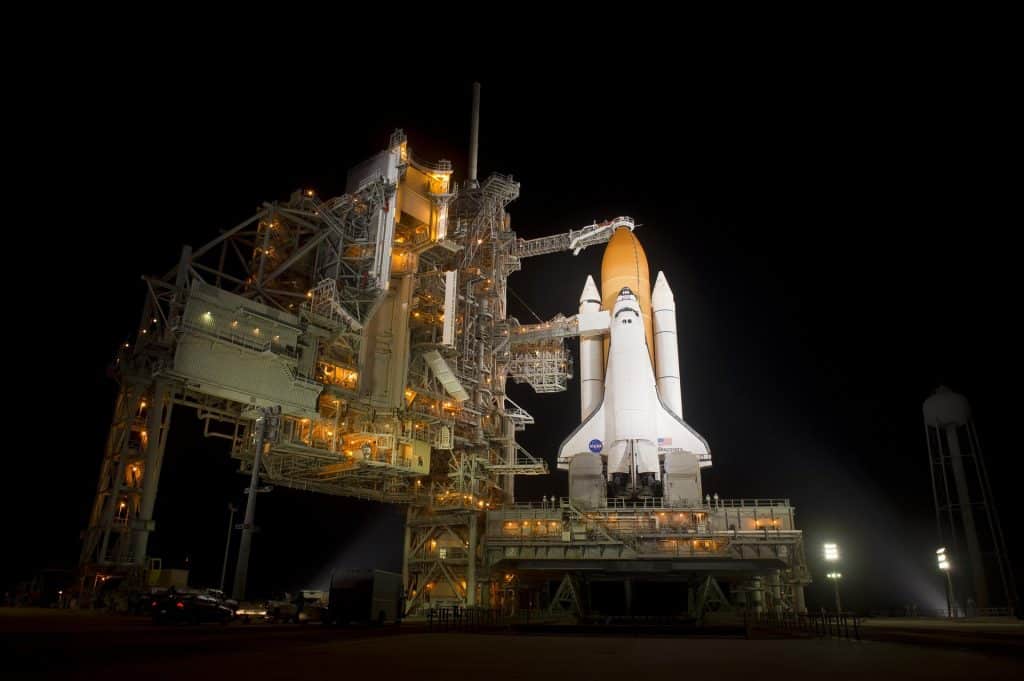 NASA's 2010 Discovery space shuttle on launch pad 39A. Discovery functions as a model for the novel Atmosphere's Navigator space shuttle. Both space shuttles have similar designs and the same purpose: spaceflights to the International Space Station.