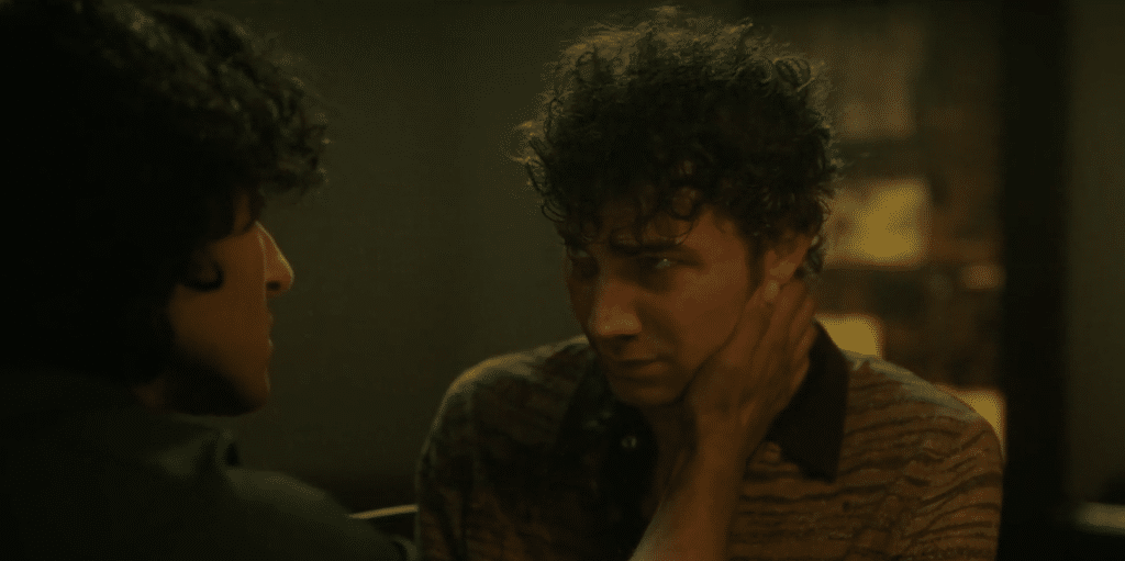 Armand cradles the face of a younger, deeply emotional Daniel Molloy.