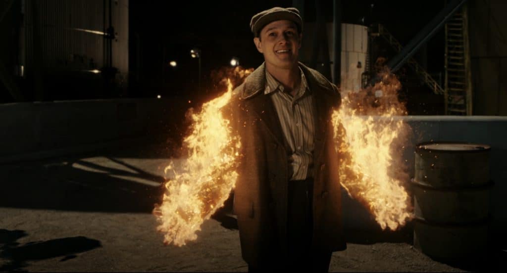 James Addison lighting up on fire on his arms.