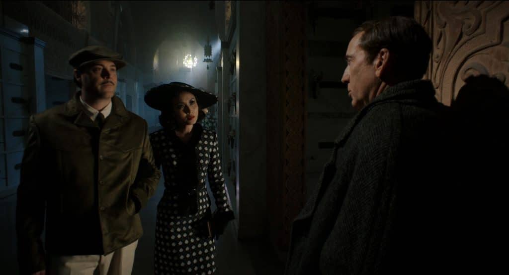 Flint and Cat are standing together opposite Ben.