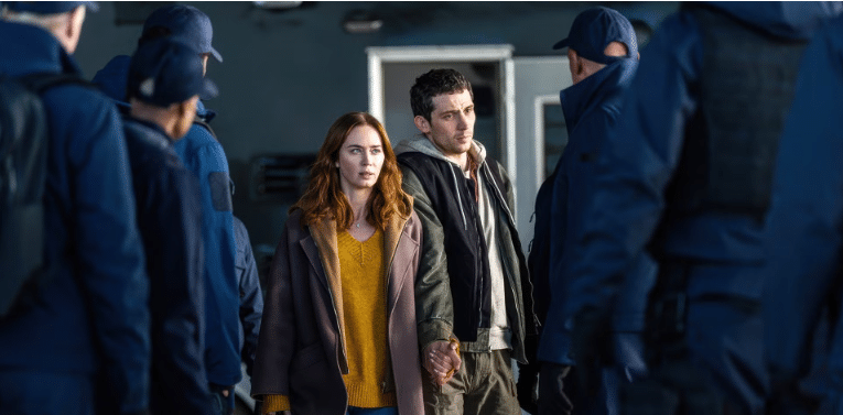 Emily Blunt's Margaret Fairchild and John O'Connor's Daniel Kellner surrounded by private agents.