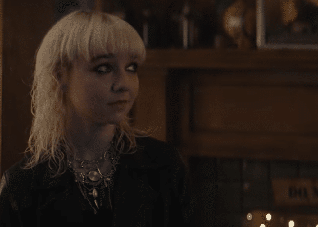 Someone looking to the side with shoulder-length blonde hair