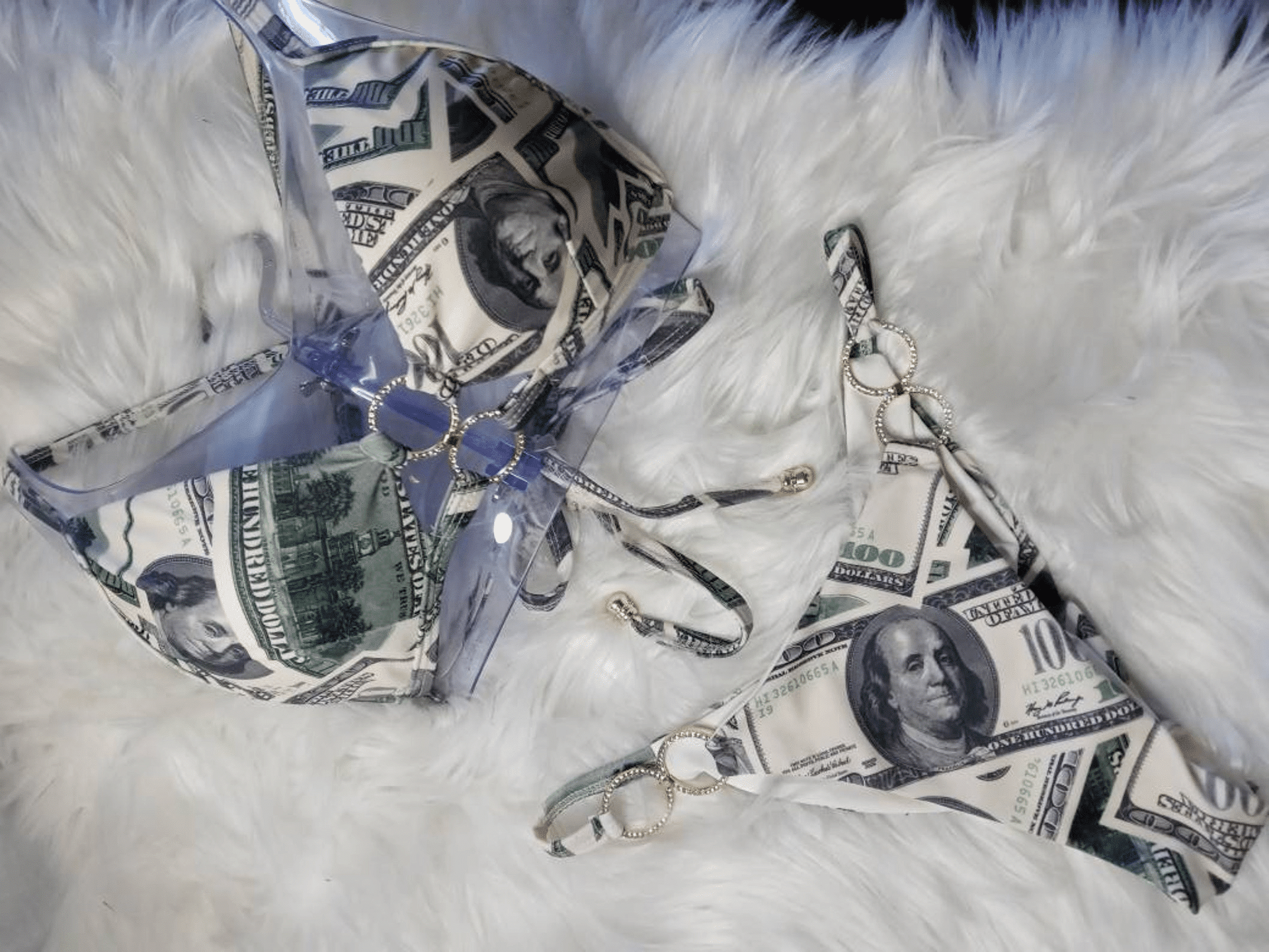 The bikini is laid out, both top and bottom pieces, on the ground. The shot is close enough to the bikini that the pattern is clear, while the shot is far enough away that the entirety of the set is shown, too.