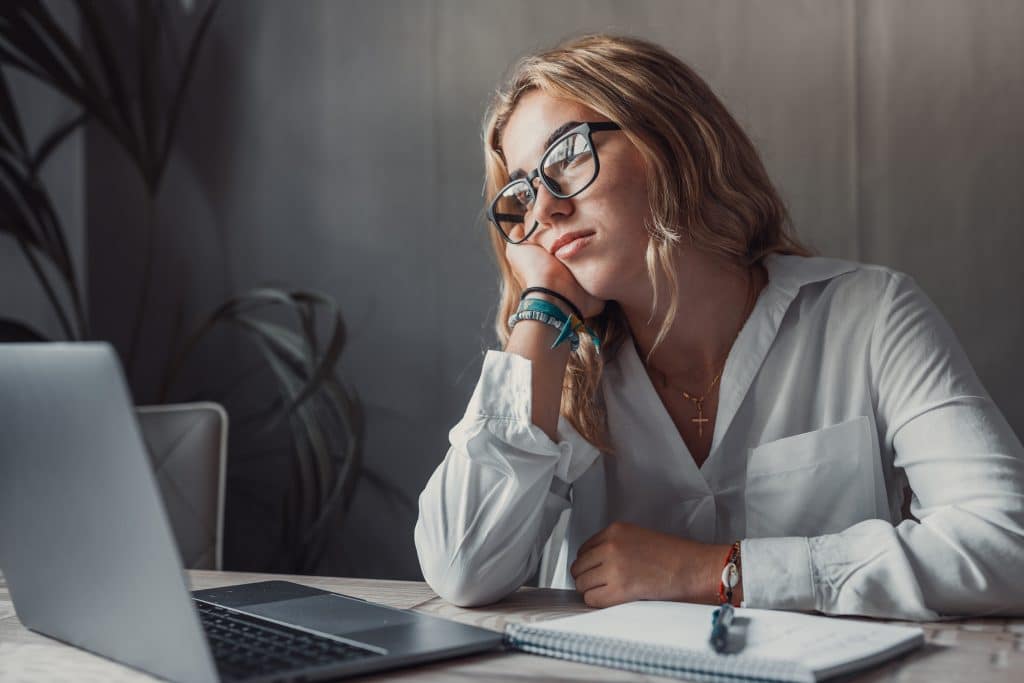 Sad woman working