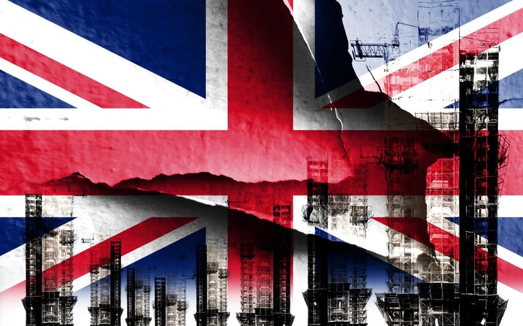 Double exposure creative hologram of unfinished super high-rise building and Union Jack. Describing the UK housing crash, rising prices, financial turmoil and inflation
