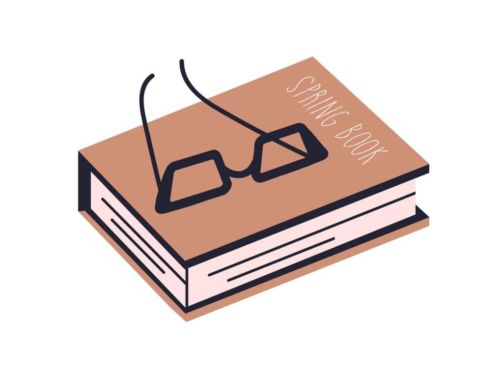 A closed book with glasses resting on top.