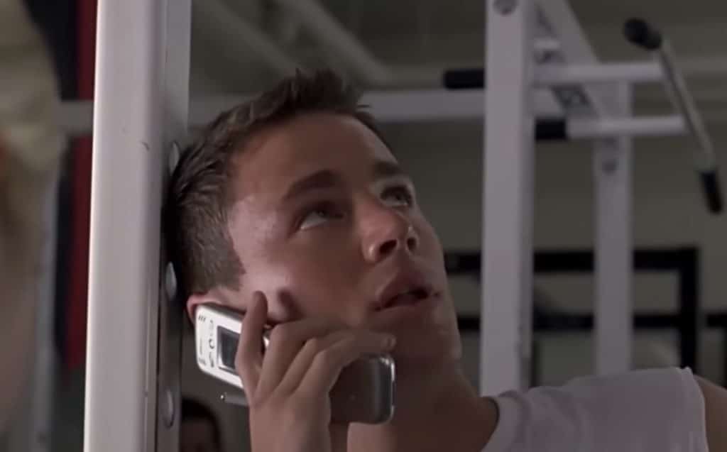 Man holding an old flip phone