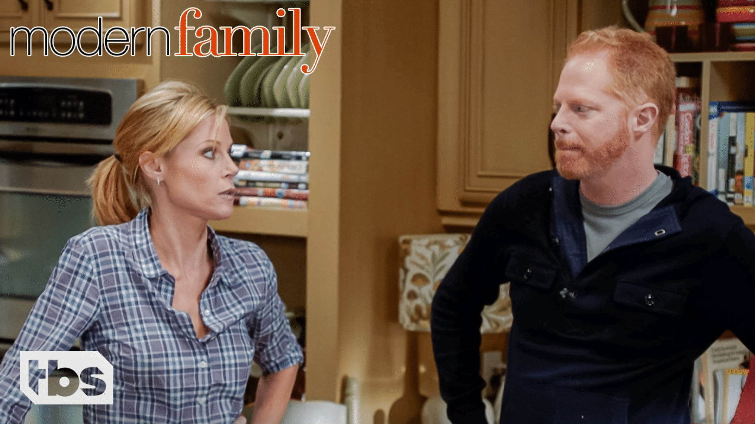 A still from "Modern Family" of a man and a woman looking at each other exasperated.