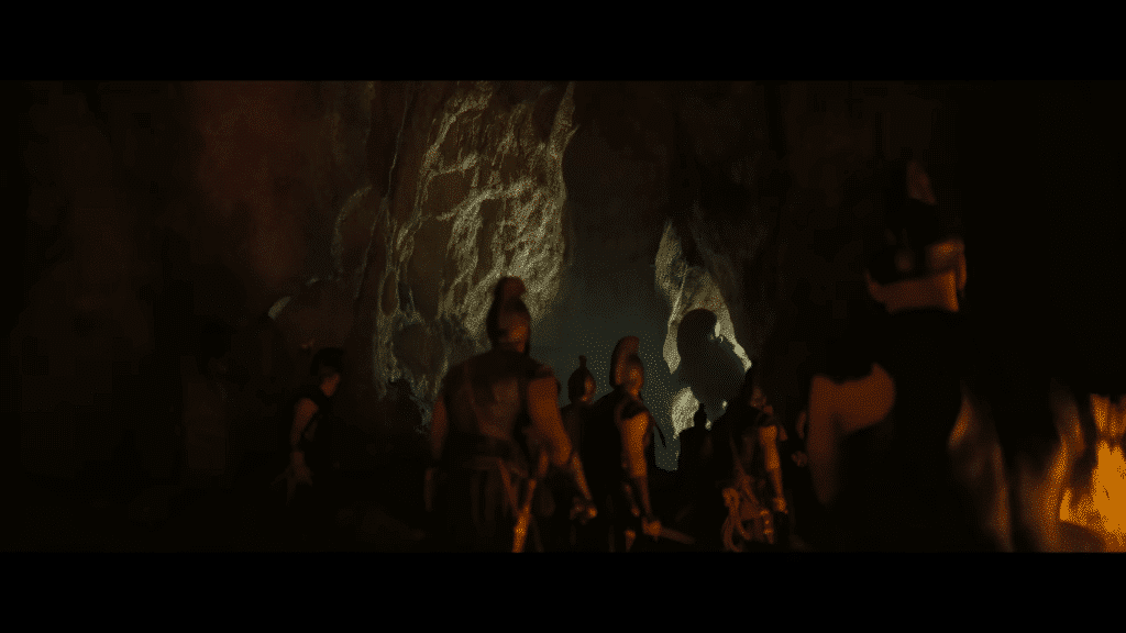 The cyclops approaches Odysseus and his men in a cave.