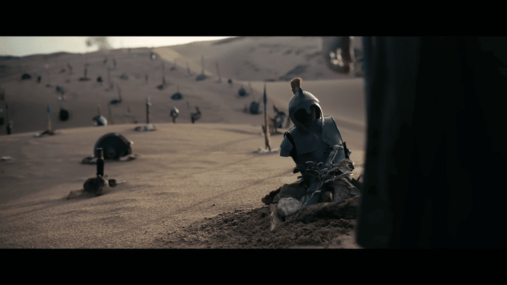 Graves bearing armor in the desert.