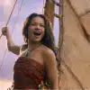 A screencap of a scene from the live action 'Moana': Moana sings on her boat.