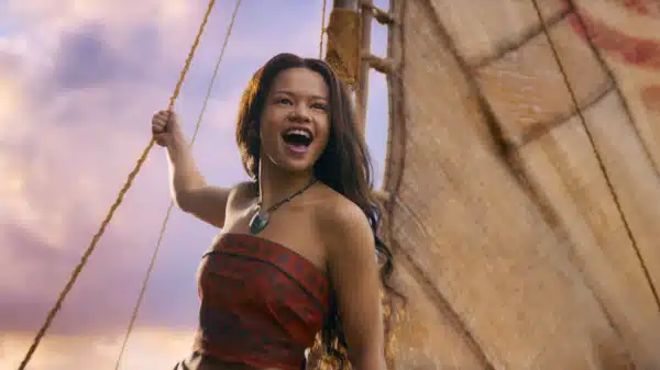 A screencap of a scene from the live action 'Moana': Moana sings on her boat.