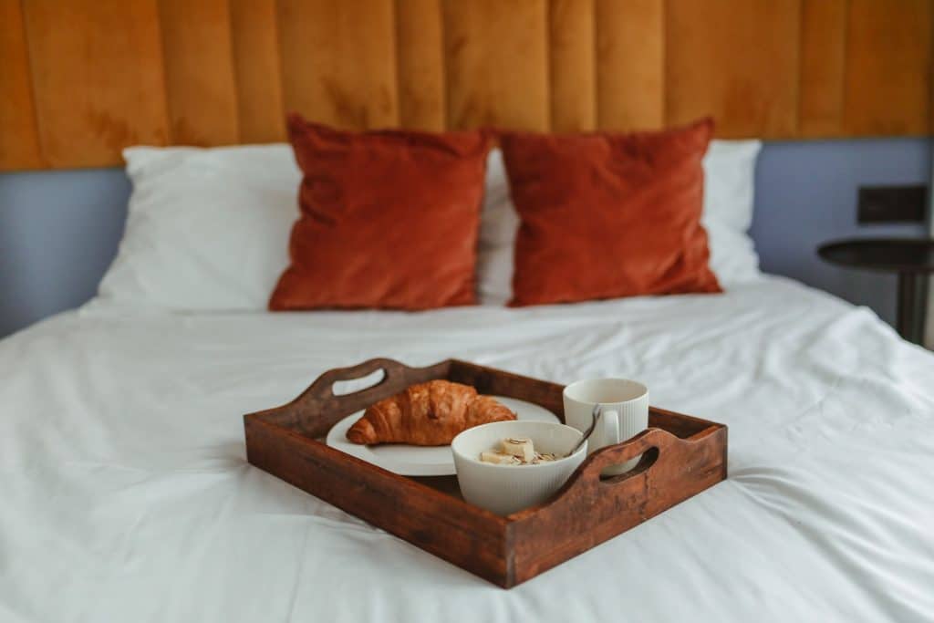 Breakfast tray laid out on a double bed