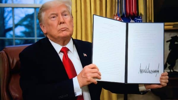 WASHINGTON, DC – January 20: President Donald Trump signs executive orders in the Oval Office of the White House on January 20, 2025, in Washington, DC. Trump assumes office for his second term as the 47th President of the United States.