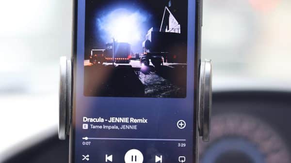 An image of a smartphone playing the song "Dracula - JENNIE remix" by Tame Impala